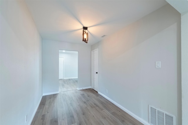 spare room featuring light hardwood / wood-style floors