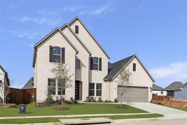 french country inspired facade with a front lawn and a garage