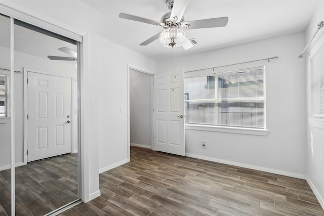 unfurnished bedroom with hardwood / wood-style flooring and ceiling fan