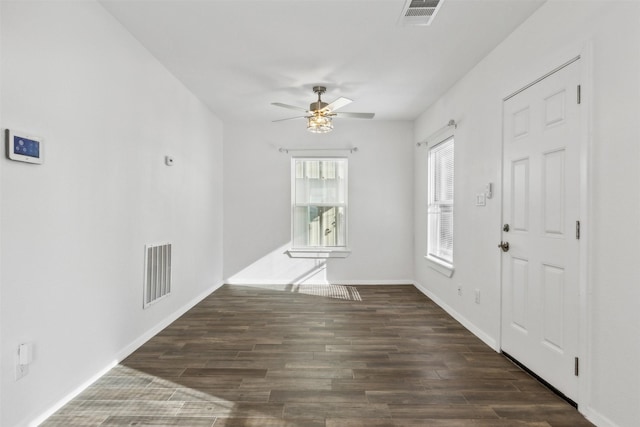 interior space with dark hardwood / wood-style flooring and ceiling fan