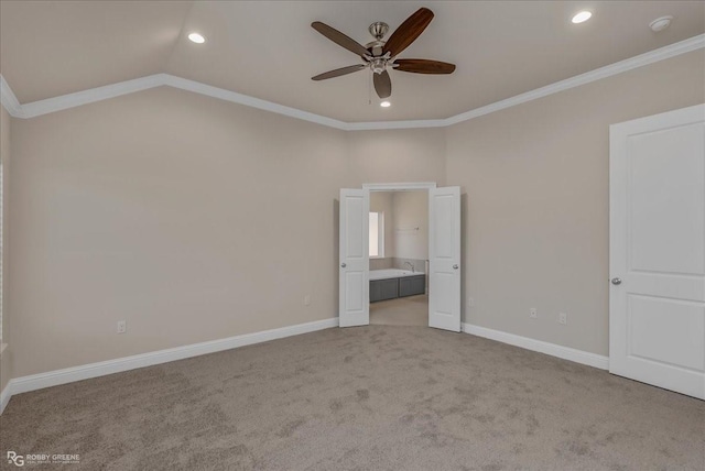 unfurnished bedroom with ceiling fan, ornamental molding, light carpet, and vaulted ceiling