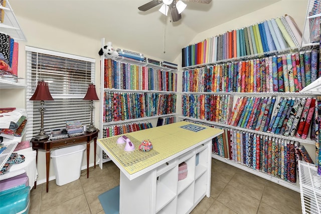 interior space featuring light tile patterned floors and ceiling fan