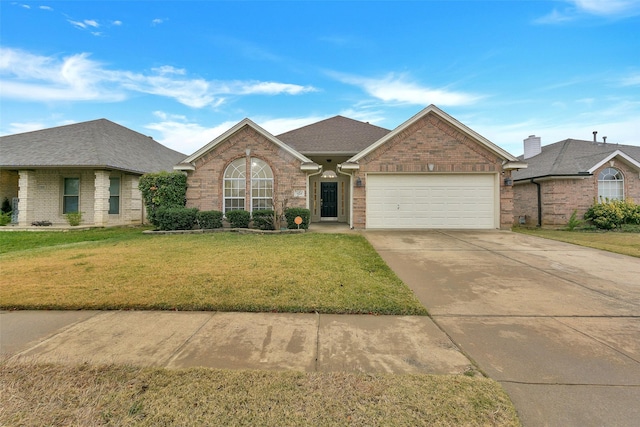 ranch-style home featuring a garage and a front yard