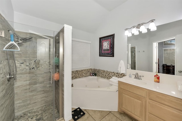 bathroom with tile patterned flooring, vanity, and separate shower and tub