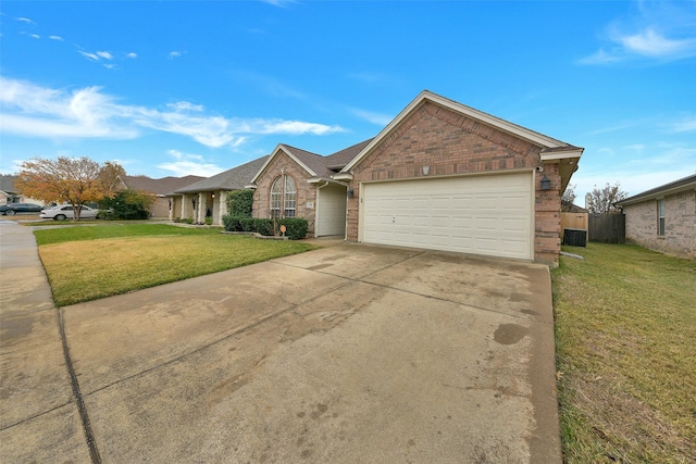 ranch-style home featuring a front yard and a garage