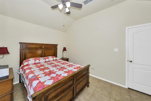 tiled bedroom with ceiling fan and lofted ceiling