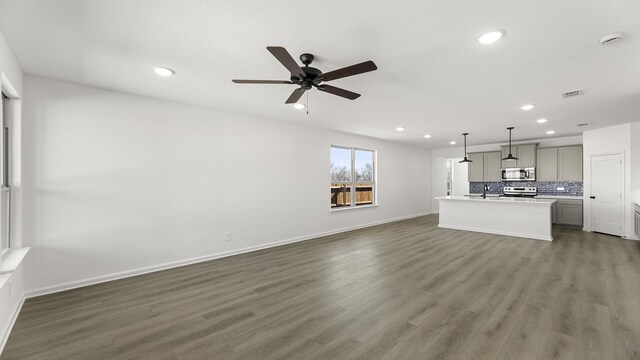 unfurnished bedroom featuring carpet and ceiling fan