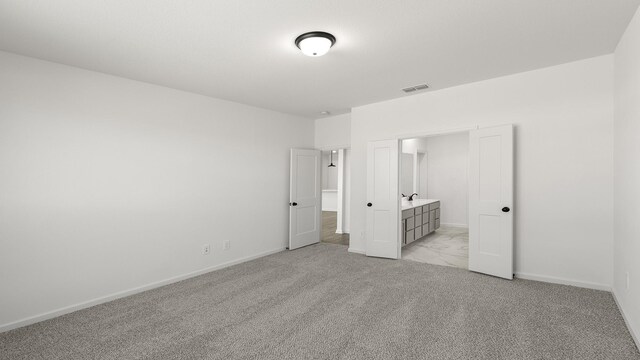 bathroom with tile patterned flooring, vanity, ceiling fan, and a shower with shower door