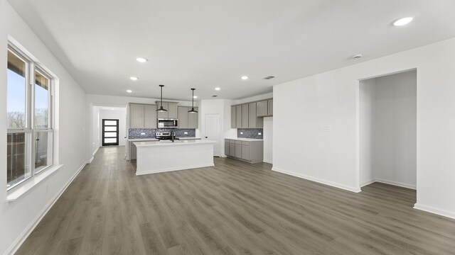 empty room featuring ceiling fan and light hardwood / wood-style floors