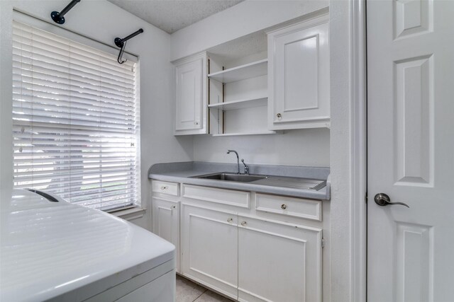 bathroom with a textured ceiling, vanity, and toilet