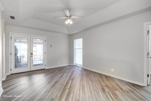 bathroom featuring heating unit, crown molding, hardwood / wood-style floors, and a bathtub