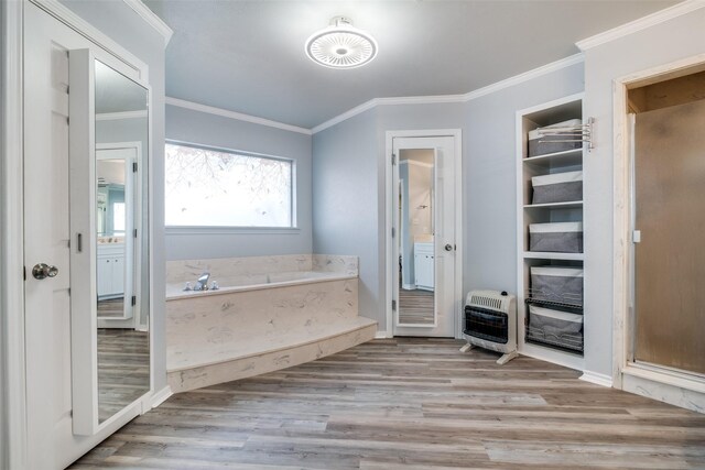 bathroom featuring hardwood / wood-style floors, vanity, heating unit, and ornamental molding