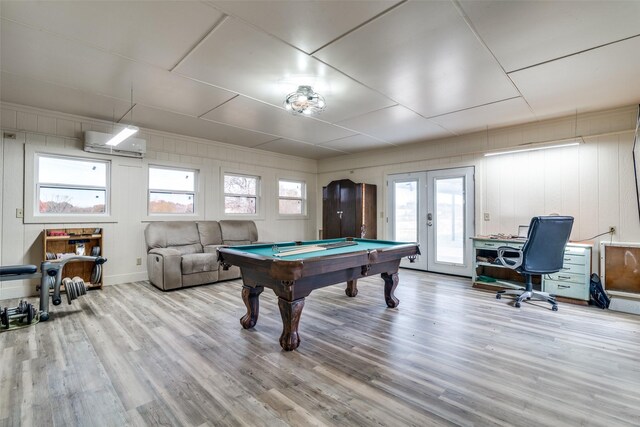 rec room featuring wood walls, wood-type flooring, pool table, and french doors