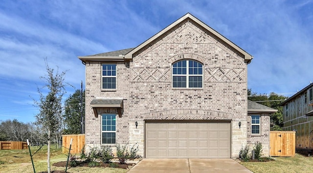 view of front facade with a garage and a front lawn