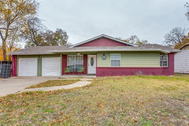 single story home featuring a garage and a front lawn