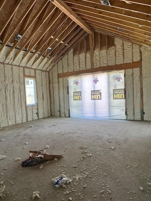 miscellaneous room featuring lofted ceiling