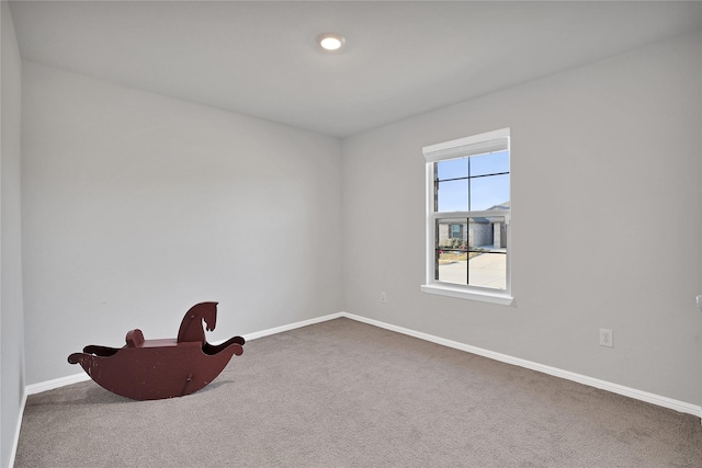 empty room with carpet flooring