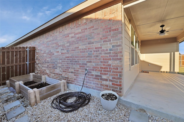 view of home's exterior featuring ceiling fan