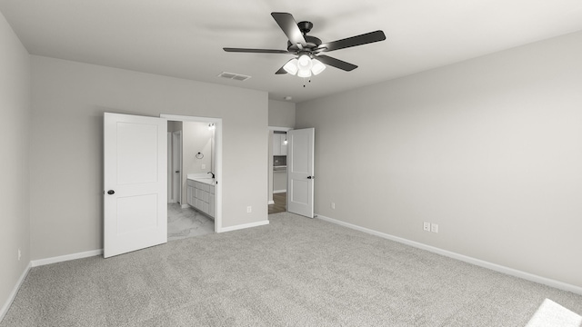unfurnished bedroom with light colored carpet, baseboards, and visible vents