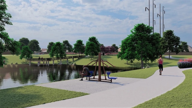 view of home's community featuring a water view and a lawn