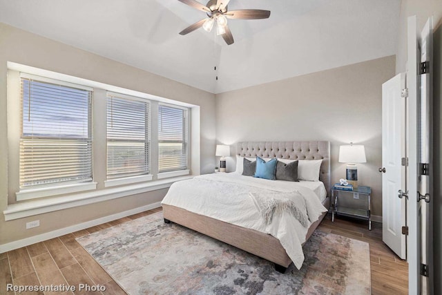 bedroom with lofted ceiling and ceiling fan