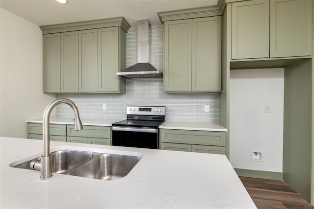 kitchen featuring decorative backsplash, wall chimney exhaust hood, sink, dark hardwood / wood-style floors, and stainless steel electric range oven