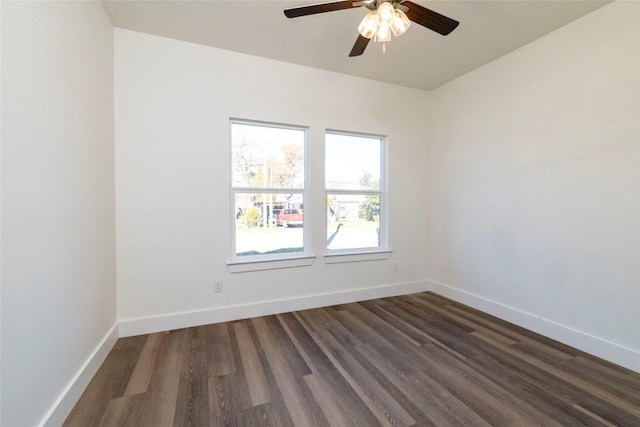 spare room featuring dark hardwood / wood-style floors and ceiling fan