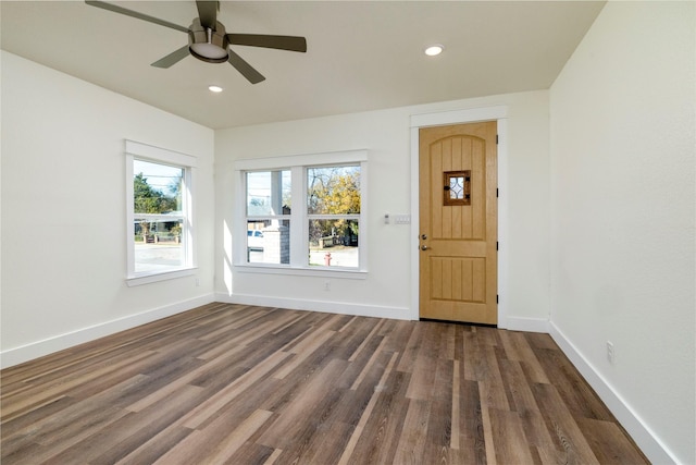 empty room featuring dark hardwood / wood-style floors and ceiling fan