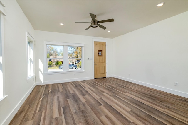 unfurnished living room featuring hardwood / wood-style flooring and ceiling fan