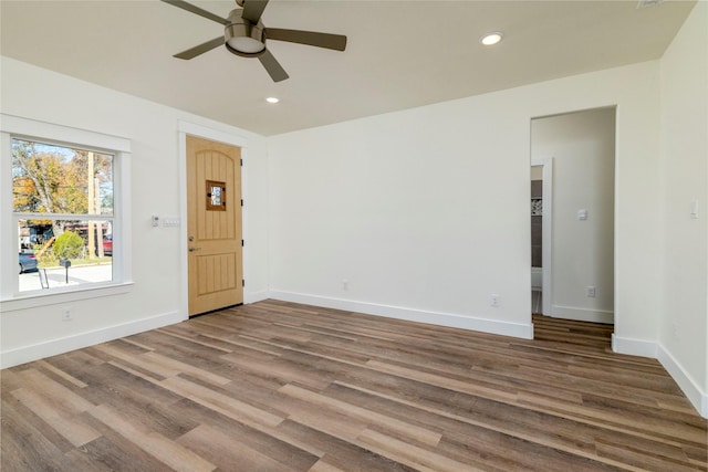 empty room featuring hardwood / wood-style floors and ceiling fan