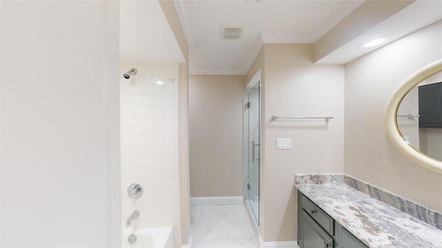 bathroom with vanity, tiled shower / bath combo, and crown molding