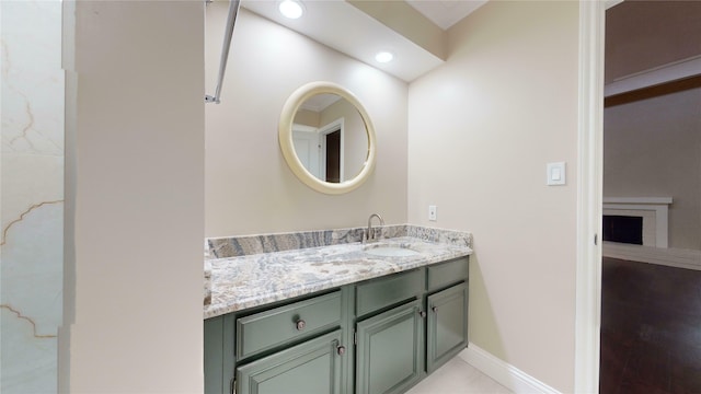 bathroom with tile patterned flooring and vanity