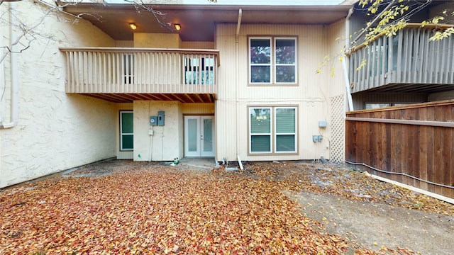 back of property featuring french doors