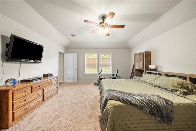 carpeted bedroom featuring vaulted ceiling and ceiling fan