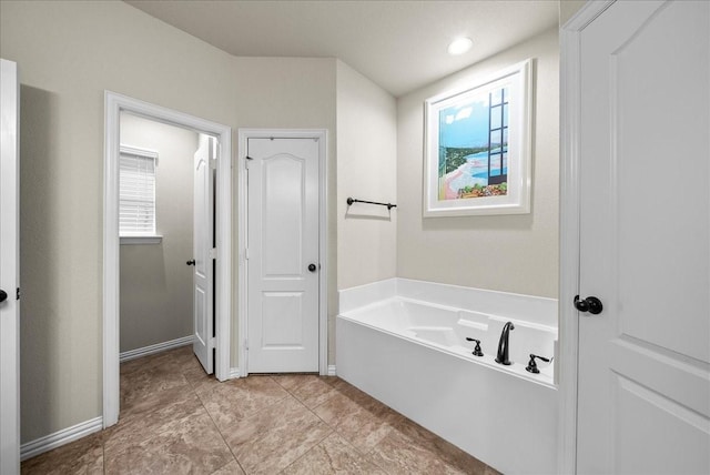 bathroom featuring a tub