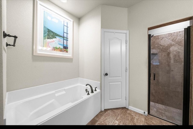 bathroom with shower with separate bathtub