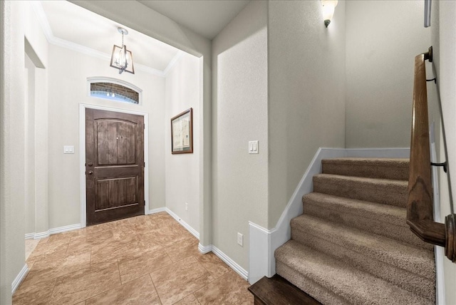 entryway featuring crown molding