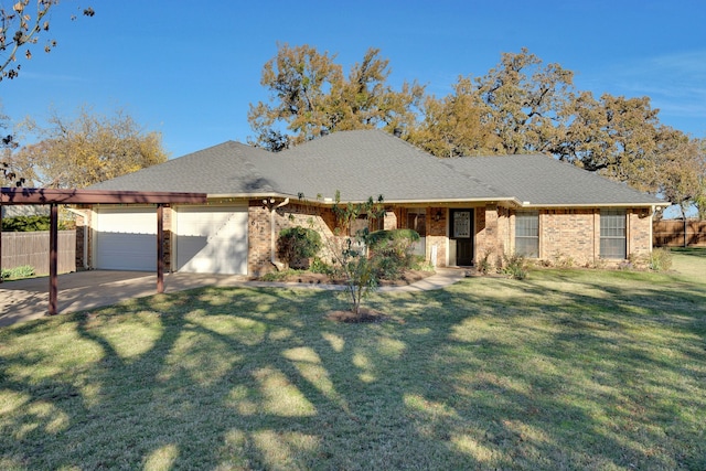 single story home with a garage and a front lawn