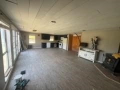 unfurnished living room featuring dark hardwood / wood-style flooring