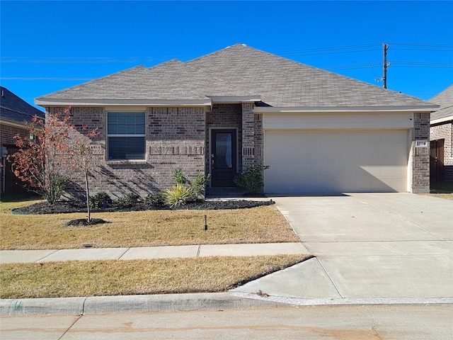 single story home with a front yard and a garage