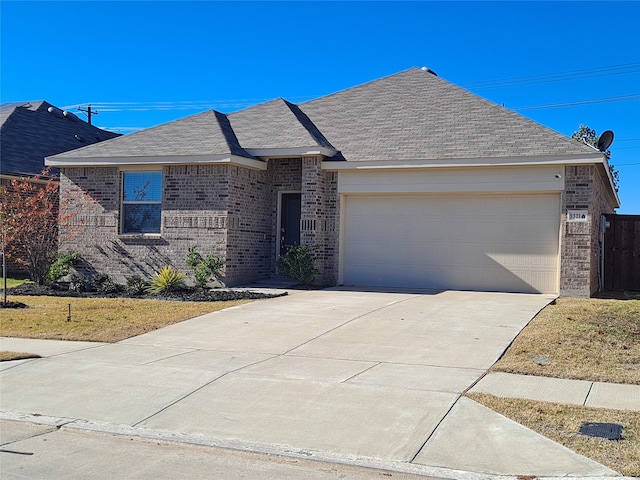 ranch-style house with a front yard and a garage