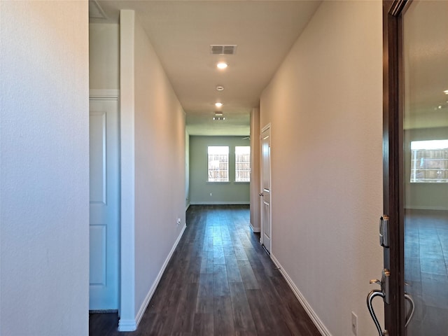 hall with dark hardwood / wood-style flooring