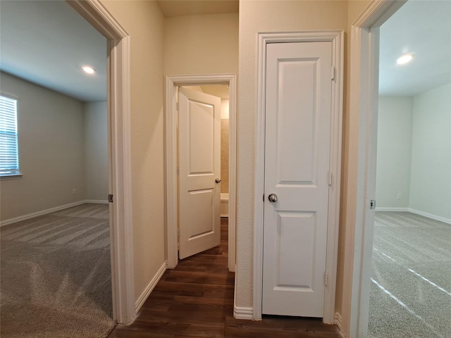 corridor with dark wood-type flooring