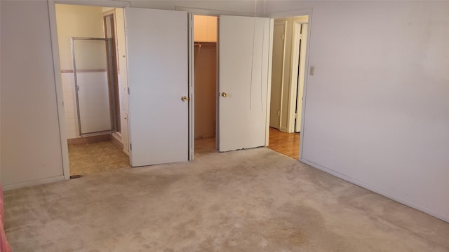 unfurnished bedroom with light colored carpet