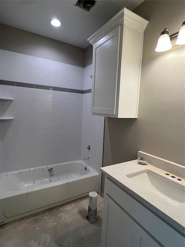 bathroom featuring vanity, bathing tub / shower combination, and concrete floors