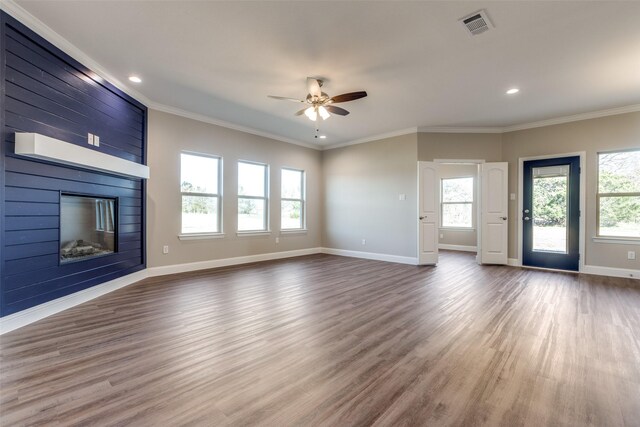 kitchen featuring backsplash, plenty of natural light, decorative light fixtures, and ceiling fan with notable chandelier