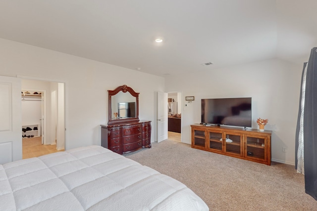 carpeted bedroom featuring vaulted ceiling