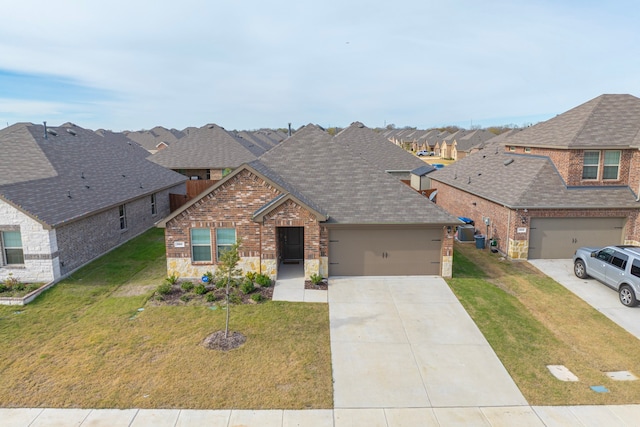 view of front of home featuring a garage and a front lawn