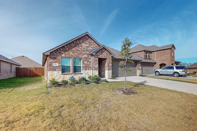 view of front of property featuring a garage and a front yard