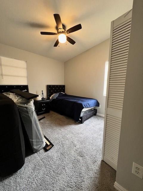 carpeted bedroom with ceiling fan